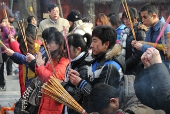 People Burning Incense in the Lama Temple (Yonghegong) in Beijing