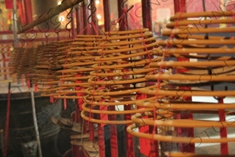 Burning Incense Cones inside Man Mo Temple in Hong Kong