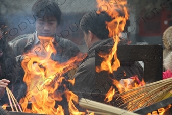 People Burning Incense in the Lama Temple (Yonghegong) in Beijing