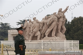 Soldier in front of a 'Heroes of the Revolution' Sculpture outside the Chairman Mao Memorial Hall/Mao's Mausoleum (Mao Zhuxi Jinnian Tang) in Tiananmen Square in Beijing