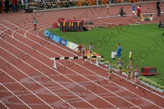 Athlete Jumping Barrier in a Women's 3,000 Metre Steeplechase Heat in the Bird's Nest/National Stadium (Niaochao/Guojia Tiyuchang) in the Olympic Park in Beijing