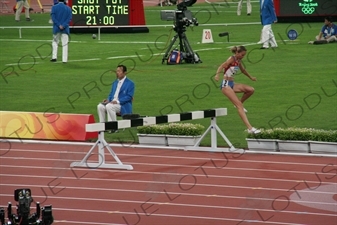 Athlete Jumping Barrier in a Women's 3,000 Metre Steeplechase Heat in the Bird's Nest/National Stadium (Niaochao/Guojia Tiyuchang) in the Olympic Park in Beijing