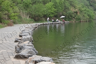 People Fishing in the Reservoir of the Huanghua Cheng Section of the Great Wall of China (Wanli Changcheng) near Beijing