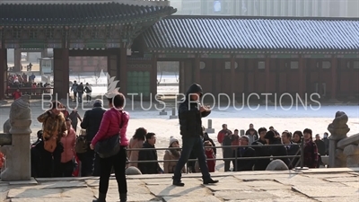 Tourists Taking Photos in front of Geunjeong Hall (Geunjeongjeon) at Gyeongbok Palace (Gyeongbokgung) in Seoul