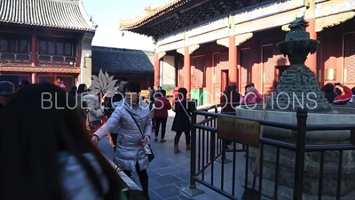 Incense Burning in front of the Hall of Peace and Harmony (Yonghegong Dian), also known as the Hall of the Three Buddhas (Sanshifo Dian) in the Lama Temple in Beijing