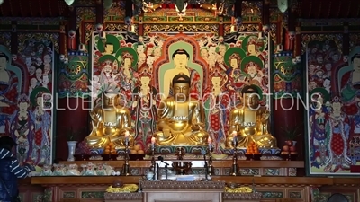 Statues of the Three Buddhas/Buddhas of the Past, Present and Future at the Haedong Yonggung Temple (Haedong Yonggungsa) in Busan