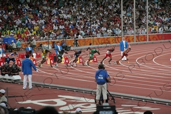 Athletes at the Start of a Men's 100 Metres Heat in the Bird's Nest/National Stadium (Niaochao/Guojia Tiyuchang) in the Olympic Park in Beijing