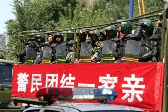 Chinese People's Armed Police Force/PAP (Zhongguo Renmin Wuzhuang Jingcha Budui/Wujing) Officers in a Personnel Transport Vehicle in Urumqi