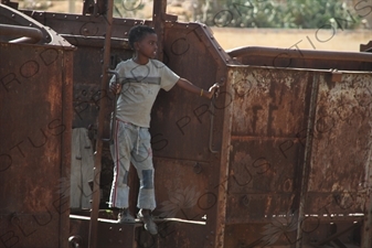 Child Playing on an Old Railway Car in a Station along the Asmara to Massawa Railway Line