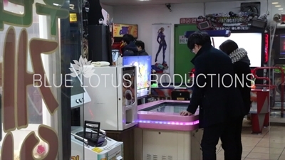 People Playing Games in an Arcade in Seoul