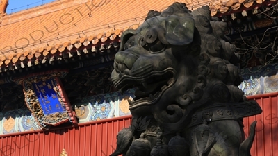 Lion Guardian Statue and Gate of Peace and Harmony (Yonghe Men) in the Lama Temple in Beijing