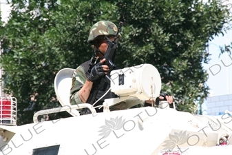 Chinese People's Armed Police Force/PAP (Zhongguo Renmin Wuzhuang Jingcha Budui/Wujing) Officer in an Armoured Personnel Carrier in Urumqi