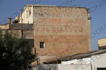 Old Colonial Writing on the side of a Building Advertising Champagne and Vermouth in Asmara