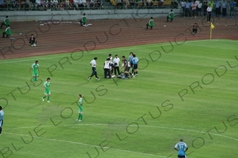 Injured Player During a Chinese Super League Match between Beijing Guoan and Dalian Shide at the Workers' Stadium (Gongren Tiyuchang) in Beijing