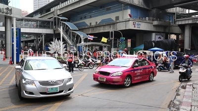 Motorcycle Taxis in front of the Asok BTS Station in Bangkok