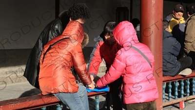 People Playing Cards in the Long Corridor (Chang Lang) in the Temple of Heaven (Tiantan) in Beijing