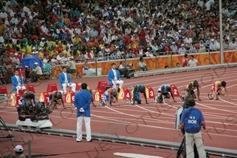 Athletes at the Start of a Men's 100 Metres Heat in the Bird's Nest/National Stadium (Niaochao/Guojia Tiyuchang) in the Olympic Park in Beijing