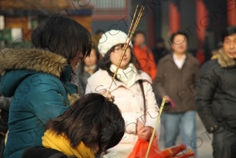 People Burning Incense in the Lama Temple (Yonghegong) in Beijing