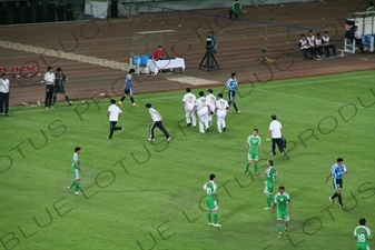 Injured Player During Chinese Super League Match between Beijing Guoan and Dalian Shide at the Workers' Stadium (Gongren Tiyuchang) in Beijing