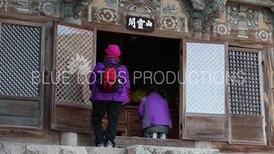 Person Praying at Dokseong Hall (Dokseongjeon) at Beomeosa Temple in Busan