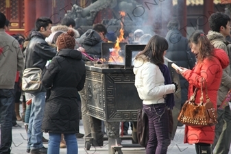 People Burning Incense in the Lama Temple (Yonghegong) in Beijing