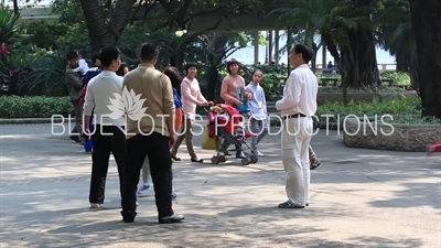 People Playing Shuttlecock (Jianzi/Ti Jianzi/Jianqiu) in a Park in Guangzhou