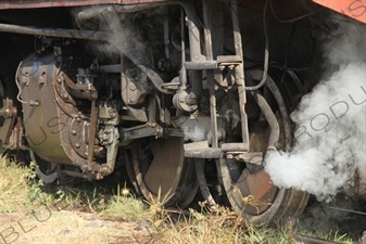 Steam Coming out from behind a Wheel on a Vintage Steam Engine Going from Asmara to Massawa