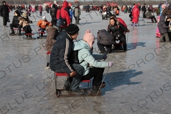 People on Sleds on the Songhua River in Harbin