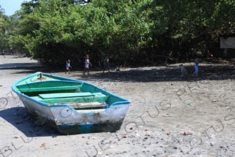 Boat and Children on a Beach in Nosara