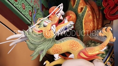 Dragon Carving on Statue of the Guardian Heavenly King of the West (Gwangmok-cheonwang) inside Cheonwang Gate (Cheonwangmun) at Beomeosa Temple in Busan