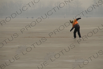 Man Slipping on a Frozen Kunming Lake in the Summer Palace in Beijing