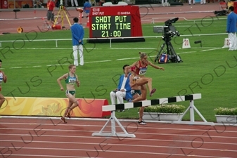 Athlete Jumping Barrier in a Women's 3,000 Metre Steeplechase Heat in the Bird's Nest/National Stadium (Niaochao/Guojia Tiyuchang) in the Olympic Park in Beijing