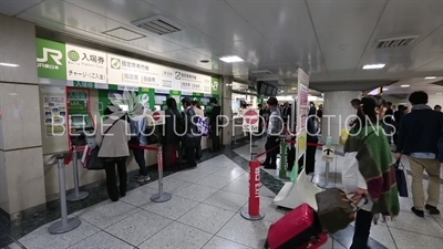 People Buying Tickets in Tokyo Train Station
