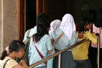 People Queuing to Enter a Building in Jakarta