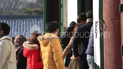 Tourists Taking Photos in the Doorway of Geunjeong Hall (Geunjeongjeon) at Gyeongbok Palace (Gyeongbokgung) in Seoul