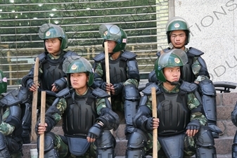 Chinese People's Armed Police Force/PAP (Zhongguo Renmin Wuzhuang Jingcha Budui/Wujing) Officers in Riot Gear on a Street in Urumqi