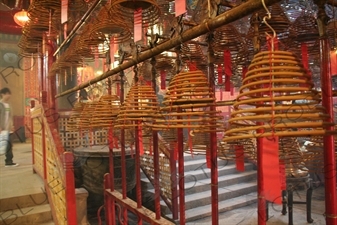 Burning Incense Cones inside Man Mo Temple in Hong Kong