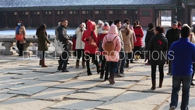 Tourists in front of Geunjeong Hall (Geunjeongjeon) at Gyeongbok Palace (Gyeongbokgung) in Seoul