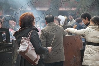 People Burning Incense in the Lama Temple (Yonghegong) in Beijing