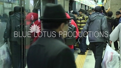 People Getting on and off a Train in a Seoul Metro station