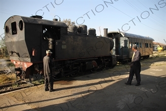 Driver and Engineer Inspecting a Vintage Steam Engine going from Asmara to Massawa