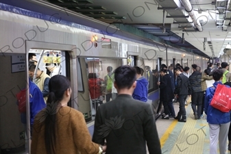 People Boarding a Line 2 Train at Chongwenmen Station in Beijing