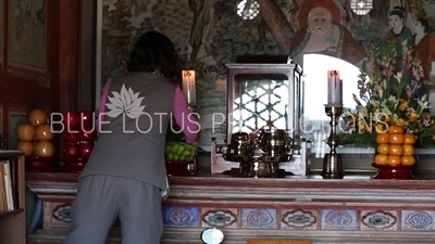 Women Arranging the Altar in Dokseong Hall (Dokseongjeon) at Beomeosa Temple in Busan