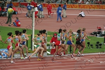 Athletes in a Women's 3,000 Metre Steeplechase Heat in the Bird's Nest/National Stadium (Niaochao/Guojia Tiyuchang) in the Olympic Park in Beijing