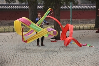 Woman Exercising with Streamers in the Temple of Heaven (Tiantan) in Beijing