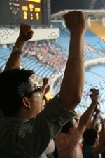 Beijing Guoan Fans Celebrating a Goal during a Chinese Super League Match against Dalian Shide at the Workers' Stadium (Gongren Tiyuchang) in Beijing