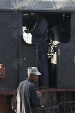 Driver and Engineer Boarding a Vintage Steam Engine going from Asmara to Massawa