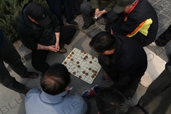 People Playing Chinese Chess near the Long Corridor (Chang Lang) in the Temple of Heaven (Tiantan) in Beijing