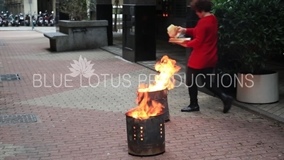 Women Burning Joss Paper/Ghost Money/Spirit Money in Macau