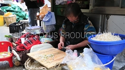 Man Peeling Beansprouts on Graham Street on Hong Kong Island